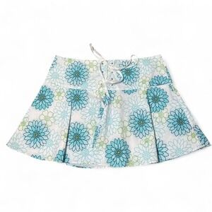 Blue floral pleated mini skirt with lace up detail